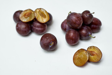 ripe plum on white background