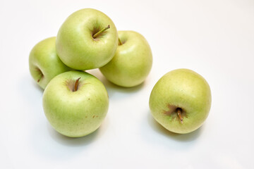 fresh ripe green apples on white background