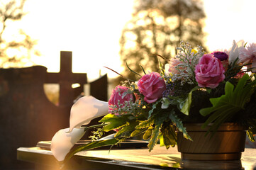 Flowers decoration on the grave on All Saints' Day - obrazy, fototapety, plakaty
