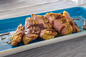 duck breast with sautéed chicory and accompanied by the sauce, chocolate and chilli