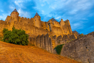 The Ancient Fortress of Carcassonne in the light of the setting sun. French Castle. High quality...