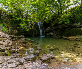 A view towards Janet Foss waterfall near Malham, Yorkshire, UK on a summers day