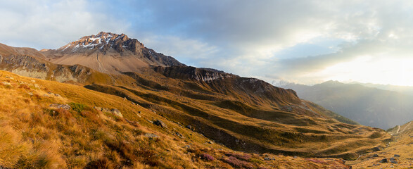 Panorama of a Swiss mountain on a beautiful sunset sky in Wallis