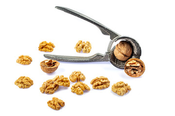 Plenty of walnuts. Delicious whole and broken walnuts, isolated on white background.