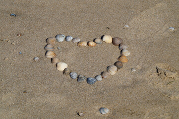 a heart made of seashells on the beautiful beach of Baltrum Island in the North Sea (Germany)	
