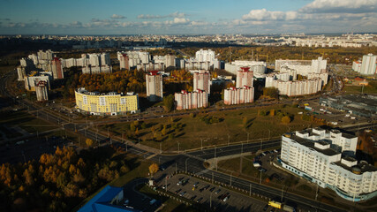 Fototapeta premium City block. Modern multi-storey buildings. Flying at dusk at sunset. Aerial photography.