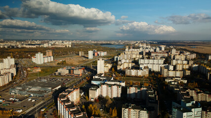 City block. Modern multi-storey buildings. Flying at dusk at sunset. Aerial photography.