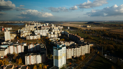 Obraz premium City block. Modern multi-storey buildings. Flying at dusk at sunset. Aerial photography.