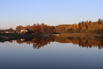 belarusian cottage village with huts and symbols