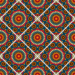 Abstract seamless backdrop. Round colorful texture in blue and yellow colors. Mandala tile background. Oriental pattern for design