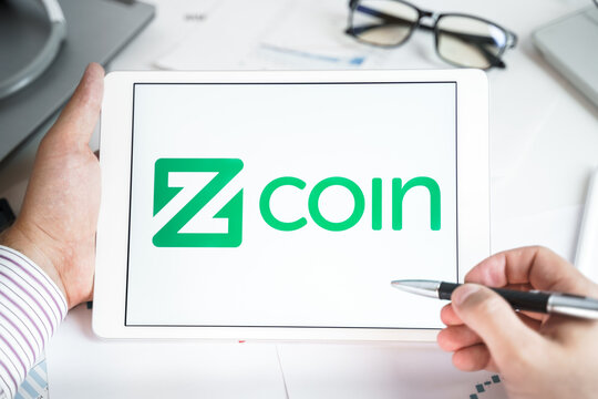 Moscow Russia 20.07.2021 Logo of Zcoin coin in mobile phone. Cryptocurrency XZC, Firo token. Trading blockchain platform to buy,sell on decentralized exchange DEX. Digital money.Business,investing