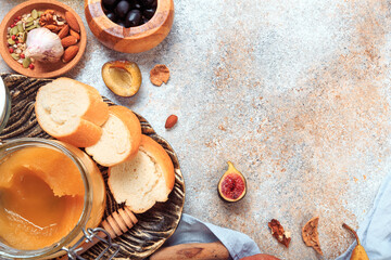 Mediterranean snacks - grapes, olives, bread, fruit, seeds - Image