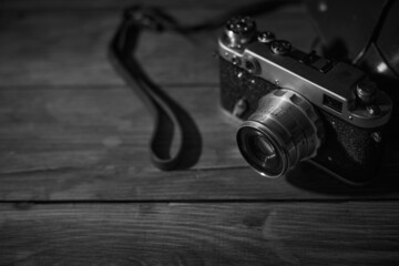 Old vintage camera on a desk, cinematic noir scene