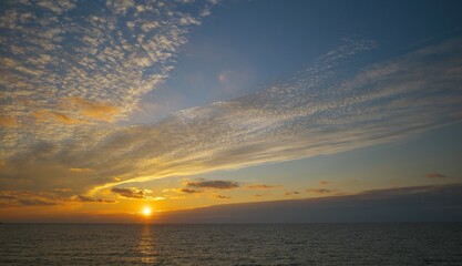 Obraz premium Sunset sky over the sea. Golden hour.