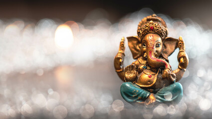 Obraz na płótnie Canvas Lord Ganesha Background with lights, glitter and clouds