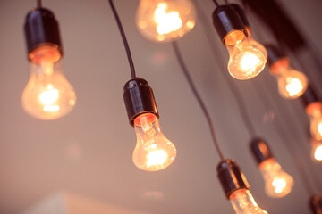 vintage light bulbs on black wires interior decoration - Image