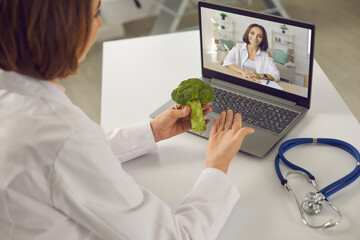 Professional dietitian, doctor, cardiologist, heart health expert, general practitioner, physician helps patient with eating habits advice recommendations at online telemedicine videocall consultation