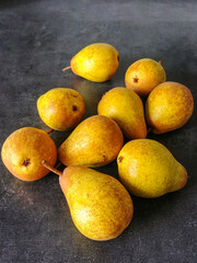 Yellow pears on a dark background
