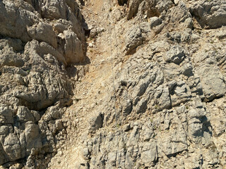 Cracks on the mountain rock background grunge texture for design