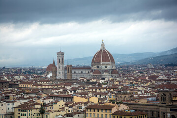 Fototapeta na wymiar Overlooking the City of Florence with the Terracotta roofs. Moody sky. 2015