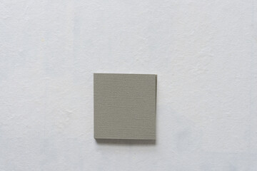 stack of gray paper squares