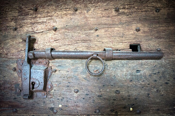 Medieval steel door bolt on old building in England 