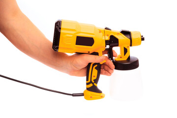 Fototapeta premium paint gun holding by mans hand isolated on white background - Image