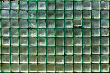 Old laminated glass as an element of industrial architecture. Textured background. Blank for design