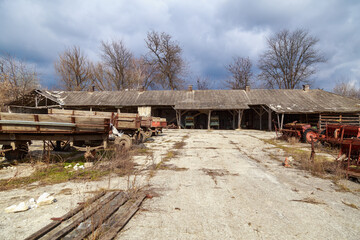 Devastation and decline in the agro-industrial sector. Cemetery of old rusty agricultural...