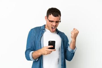 Brazilian man over isolated white background surprised and sending a message