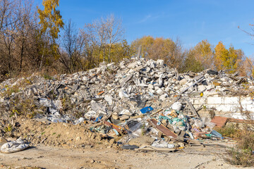 A pile of old construction waste. Concrete and wood debris, old tires and plastic debris. Illegal...