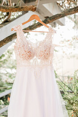 Wedding Dress - White tank top with white lace hanging from the tree, for the bride to wear during her beach wedding