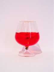 red liquor in glass