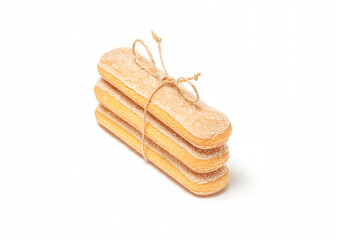 Stack of ladyfingers or savoiardi biscuits cookies tied with a rope, italian dessert, isolated on white background