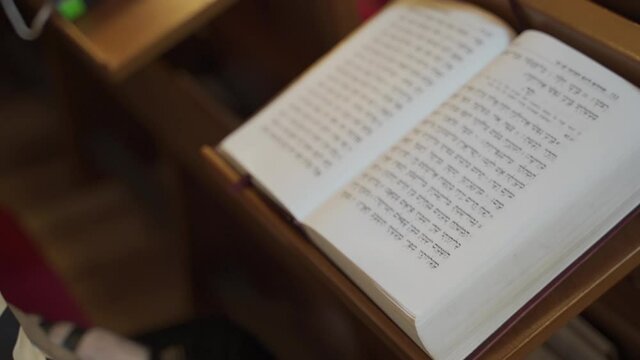 Jew pray, reads a book. Close-up of a book.