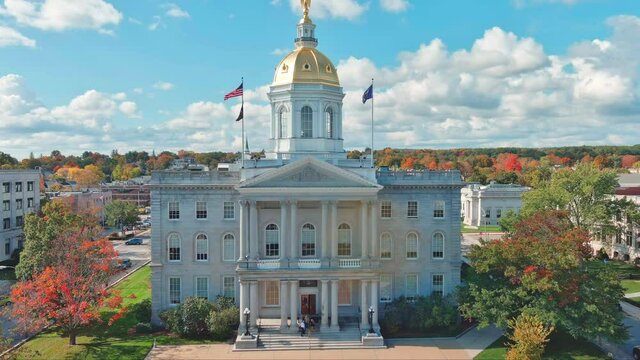 Rising in Front of NH State House Building in Autumn with Colorful Foliage