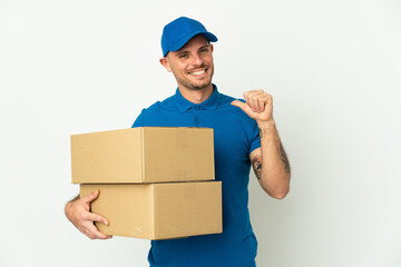 Delivery caucasian man isolated on white background proud and self-satisfied