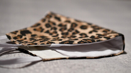 Homemade cloth covid protection mask with leopard print