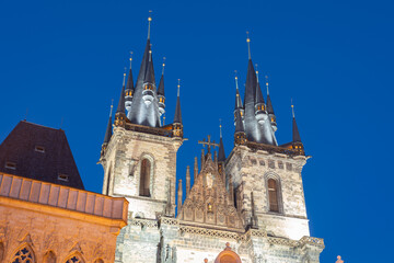 Fototapeta na wymiar Gothic Spires of Church of Our Lady before Tyn, at night against dark sky in Prague, Czech Republic