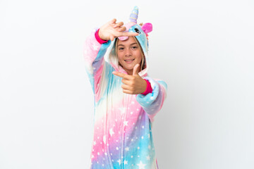 Little girl with unicorn pajamas isolated on white background focusing face. Framing symbol