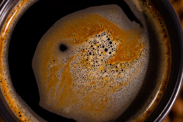 fresh dark coffee and foam