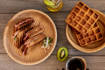 Healthy breakfast, sandwich, tea, waffle and fresh fruit