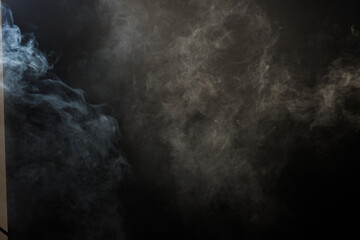 Dense Fluffy Puffs of White Smoke and Fog on Black Background, Abstract Smoke Clouds