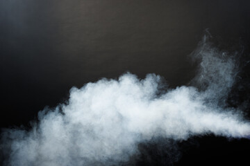 Dense Fluffy Puffs of White Smoke and Fog on Black Background, Abstract Smoke Clouds