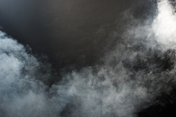 Dense Fluffy Puffs of White Smoke and Fog on Black Background, Abstract Smoke Clouds