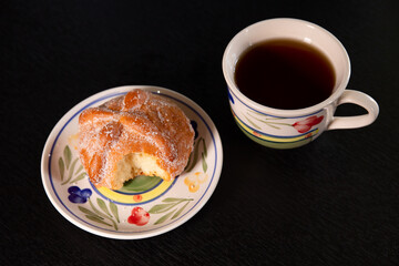 Pan de Muerto with a bite Served with coffe 