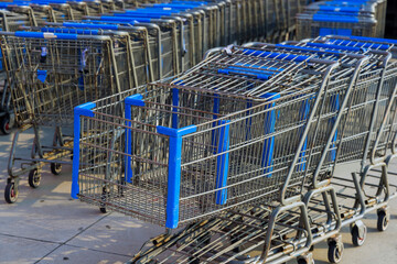 Rows of shopping carts near entrance of supermarket