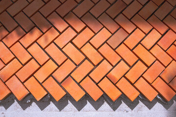 Sunlight and shadow on zig zag pattern of pedestrian pavement in under construction, top view with copy space