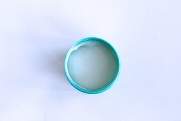 A large jar of cosmetic greasy body cream, isolated on a white background. Top view. Cosmetic products.