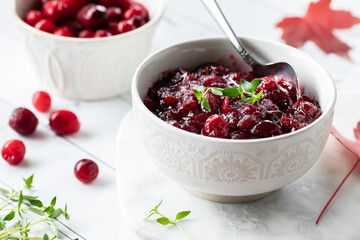 A close up view of a bowl of homemade cranberry sauce for Thanksgiving dinner.